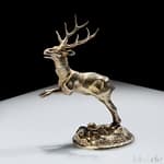 Antiques 24 Gilt silver vase in the shape of a deer, early 18th century Germany On oval base decorated with shells and crustaceans, has head that can be removed to make the sculpture a container, total weight gr. 112.